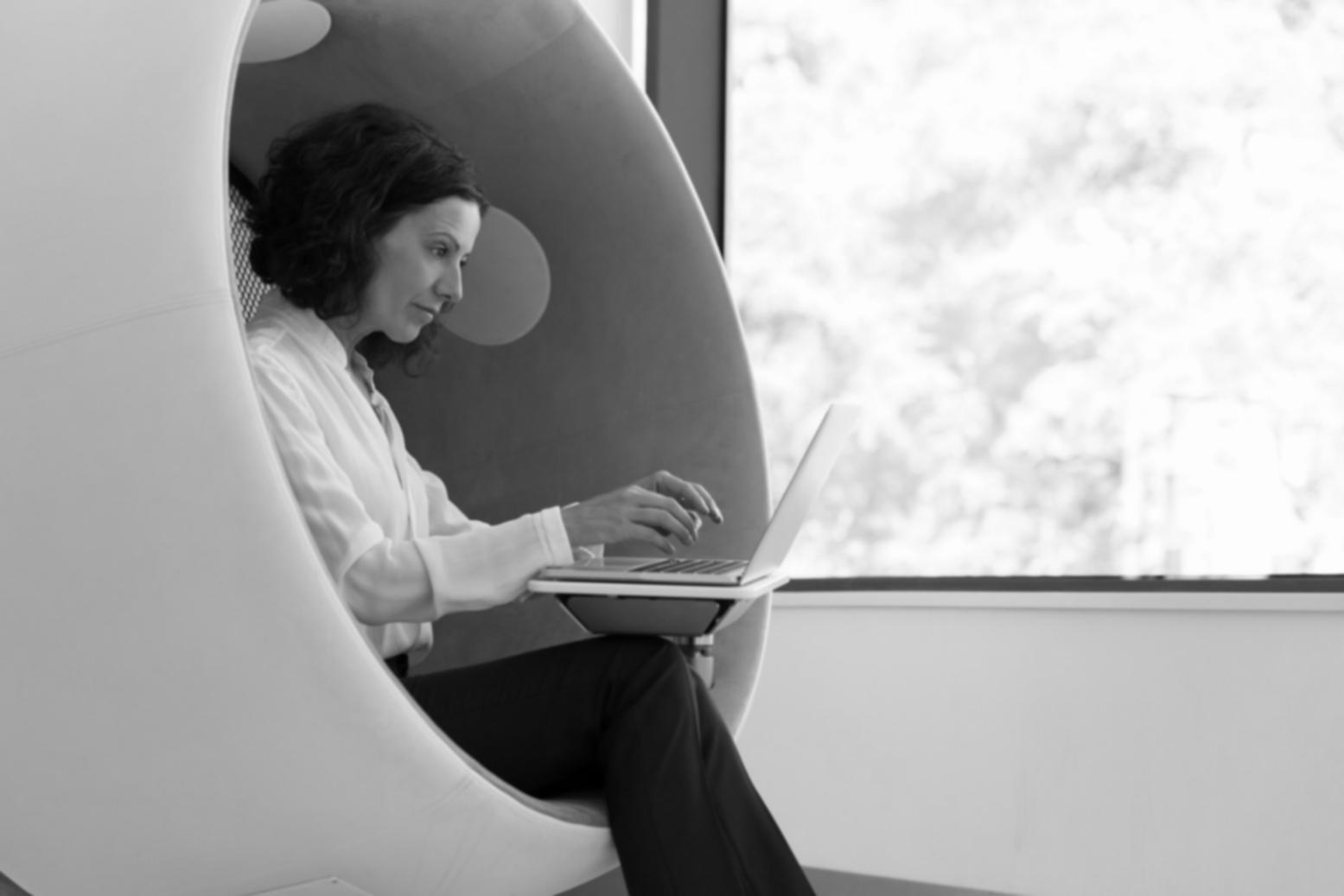 Business owner reviewing financial reports with analytical tools
